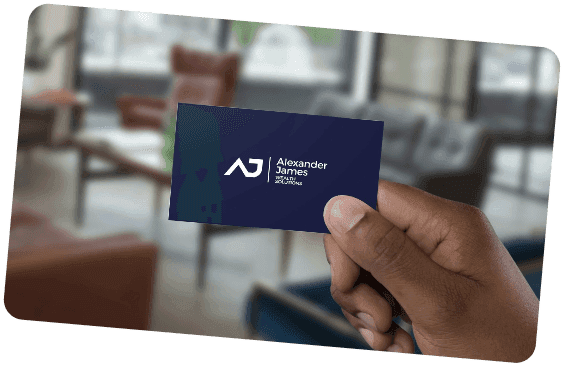 Hand holding an Alexander James business card